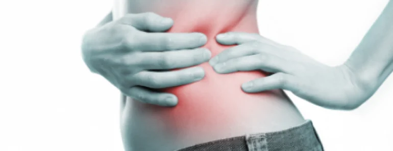 What Is Bulletproof Coffee? Complete Health Guide 10 Woman holding her side in pain
