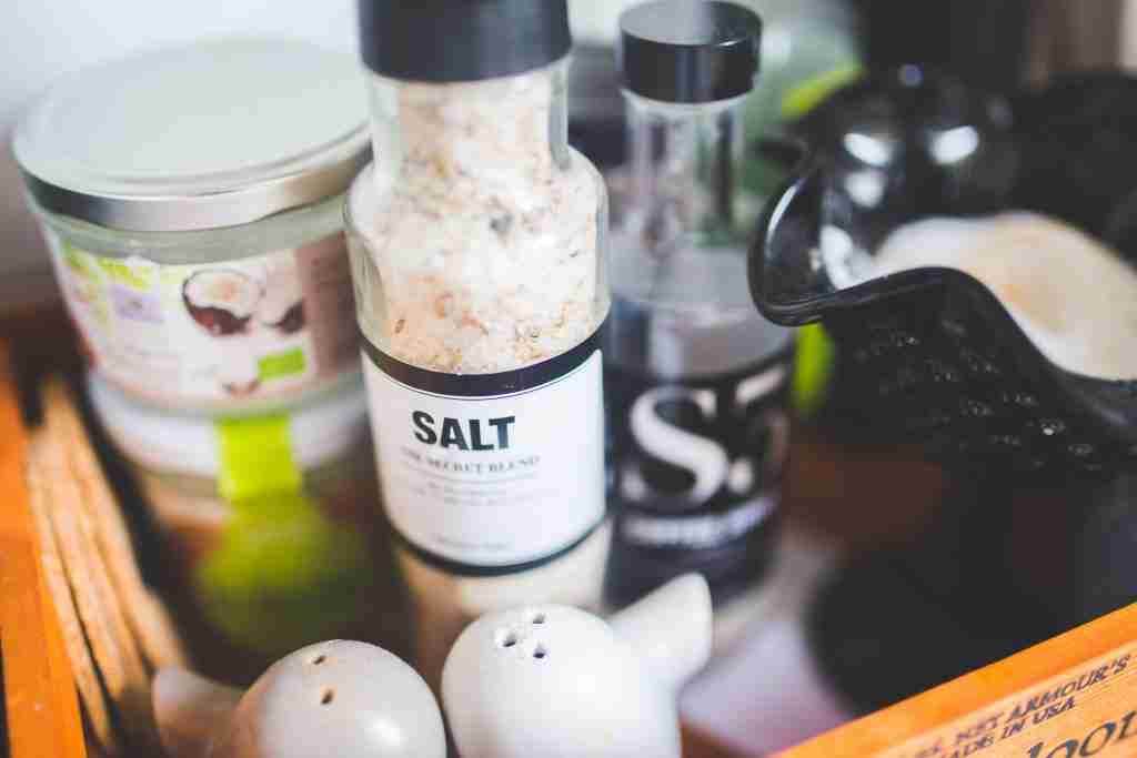 Salt used for coffee on a counter with other containers. 