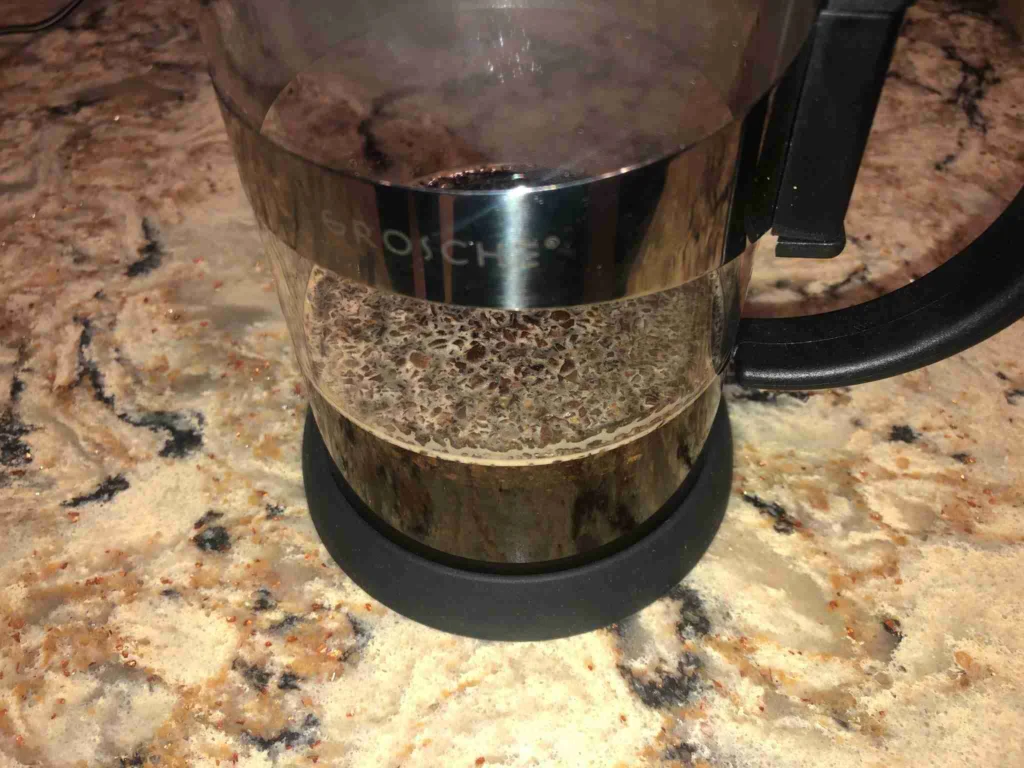 How to Make French Press Coffee 12 Pouring the rest of the water into the French press