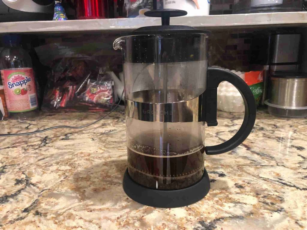 How to Make French Press Coffee 13 Pressing the French press plunger