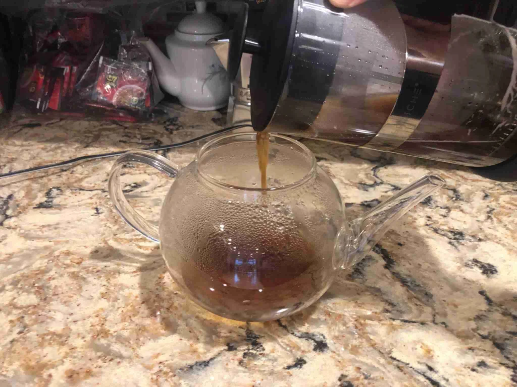How to Make French Press Coffee 14 Pouring French press coffee into a cup