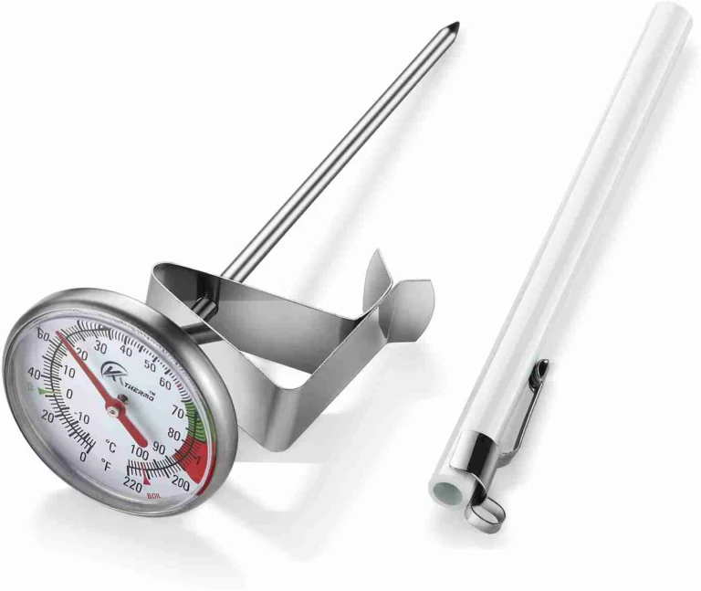 The Complete Guide on How to Make Latte Art 10 Milk frothing thermometer clipped to a steaming pitcher