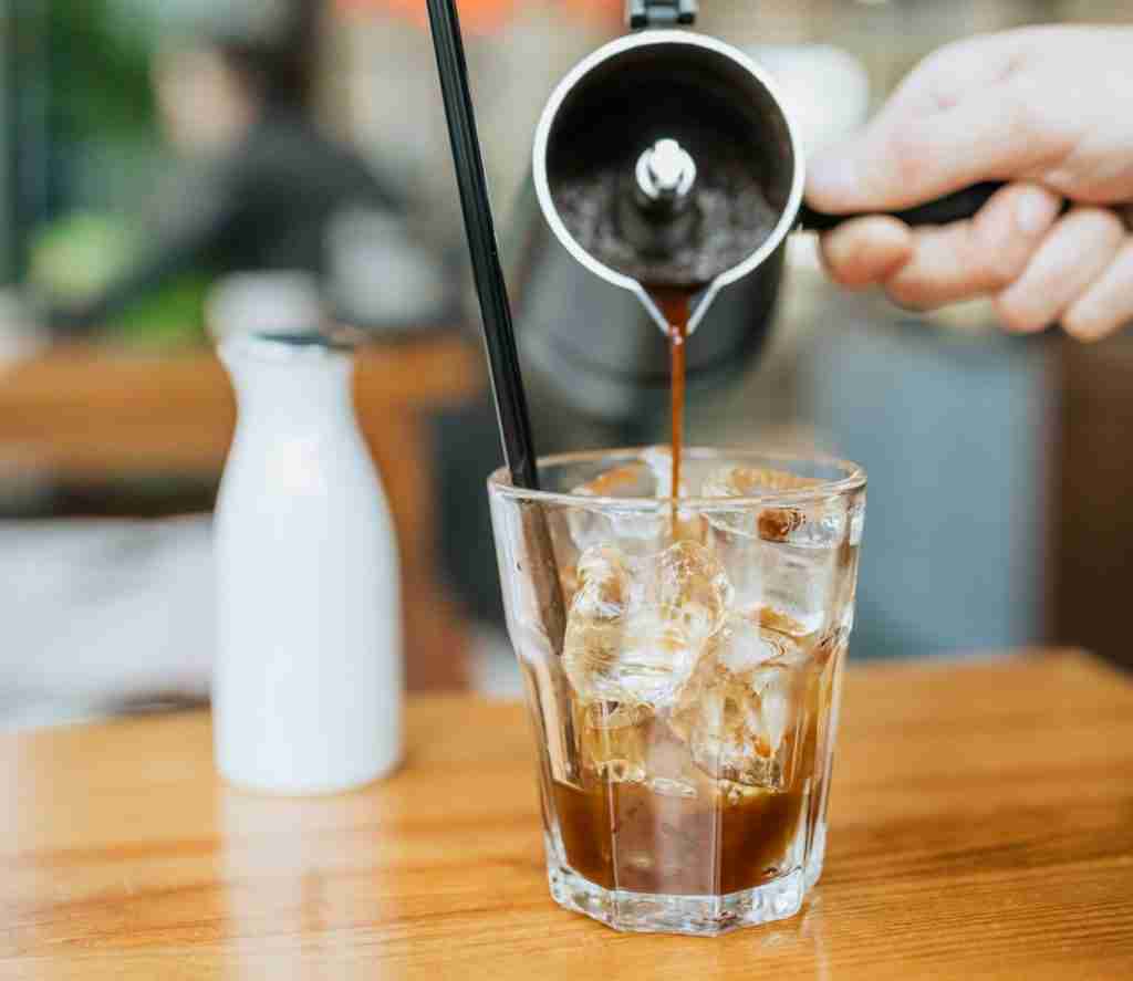 pouring coffee onto ice
