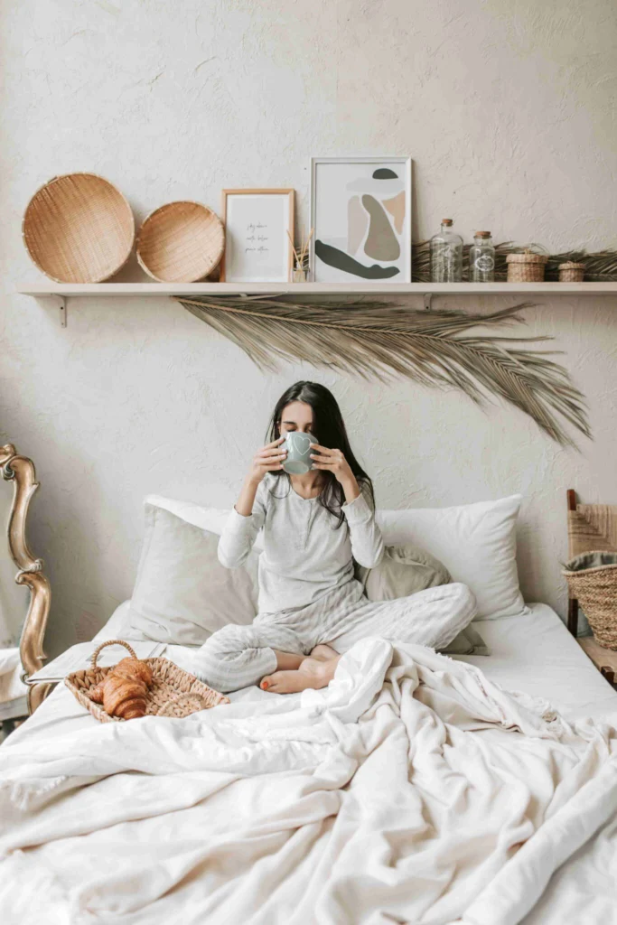 Coffee After Dinner: Is It Bad for You? 7 Woman drinking coffee in bed in the evening